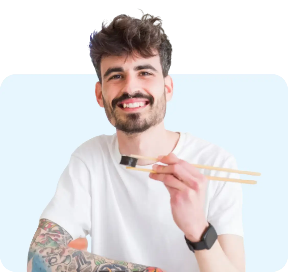 image of a man eating sushi